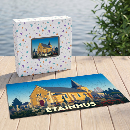 Puzzle souvenir de la ville d'Étainhus avec une illustration stylisée d'une église et de son cimetière.