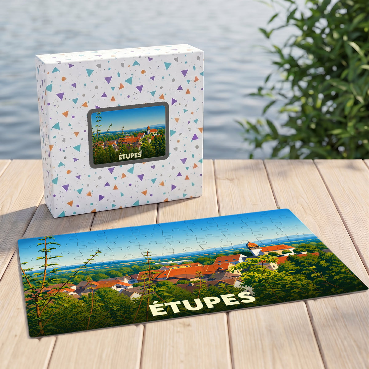 Puzzle souvenir de la ville d'Étupes avec une illustration panoramique stylisée.