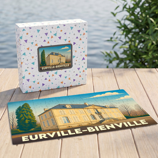 Puzzle souvenir de la ville d'Eurville-Bienville avec une illustration stylisée d'un château sur sa boîte et ses pièces assemblées.