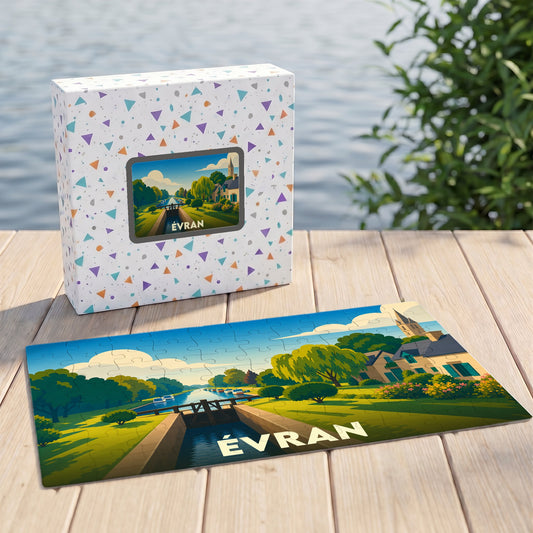 Puzzle souvenir de la ville d'Évran avec une illustration stylisée représentant un canal et son écluse.