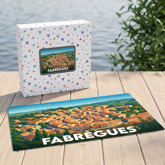 Puzzle souvenir de la ville de Fabrègues avec son illustration stylisée et sa boîte assortie.