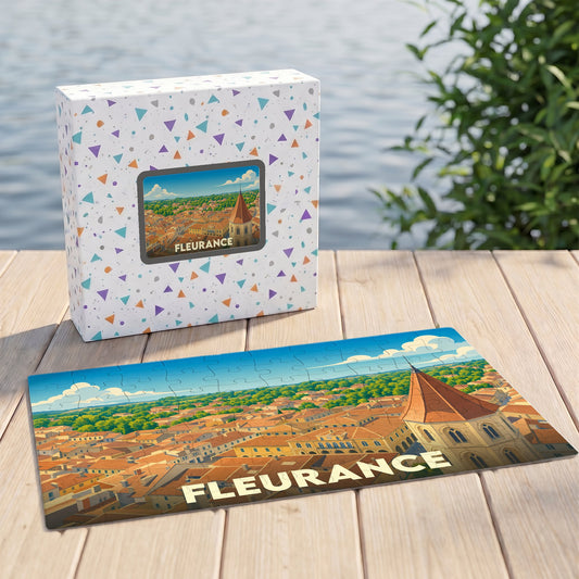 Puzzle souvenir de la ville de Fleurance présentant une illustration panoramique stylisée de ses toits et de son église.