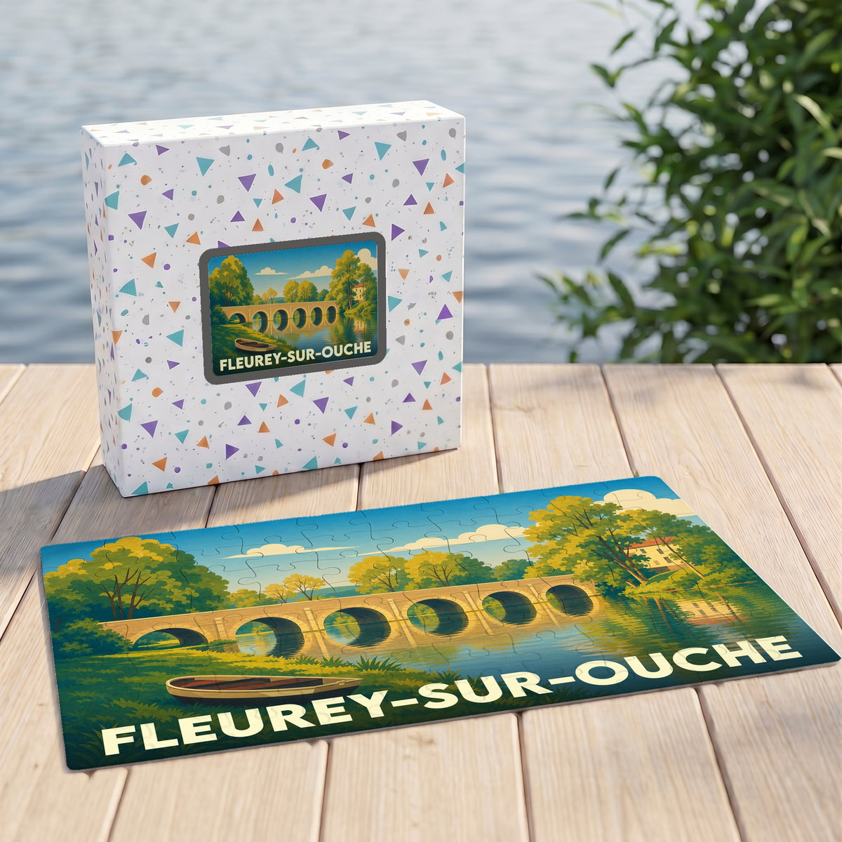 Puzzle souvenir de la ville de Fleurey-sur-Ouche illustrant un pont de pierre au bord de l'eau.