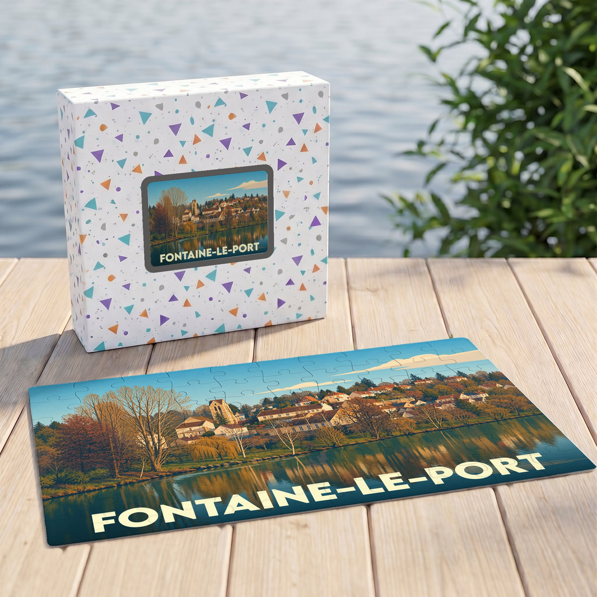 Puzzle souvenir de la ville de Fontaine-le-Port avec une illustration panoramique stylisée.