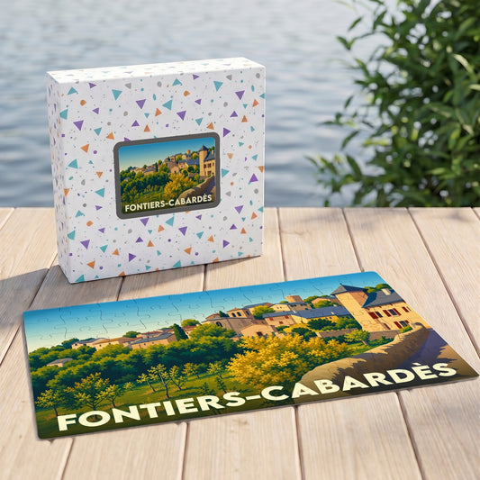 Puzzle souvenir de Fontiers-Cabardès avec une illustration stylisée du village et son nom écrit en lettres capitales.