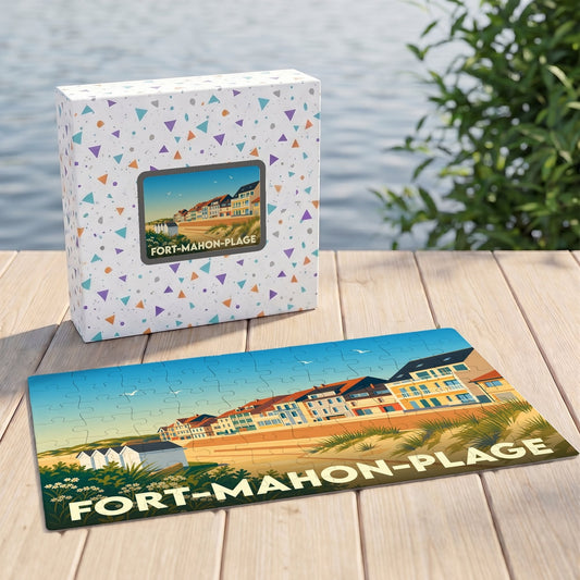 Puzzle souvenir de Fort-Mahon-Plage illustrant son front de mer sur un plateau en bois devant sa boîte assortie.