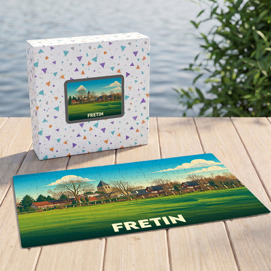 Puzzle souvenir de la ville de Fretin avec une illustration stylisée d'un paysage local.