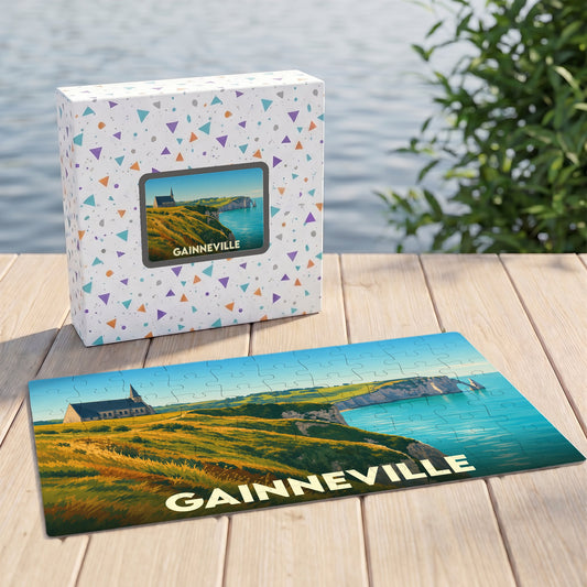 Puzzle souvenir de la ville de Gainneville avec une illustration stylisée de falaises et d'une église en bord de mer.