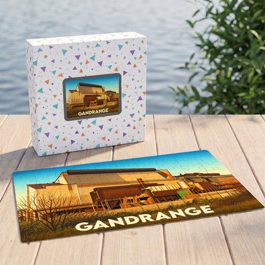 Puzzle souvenir de la ville de Gandrange avec une illustration stylisée d'un site industriel.