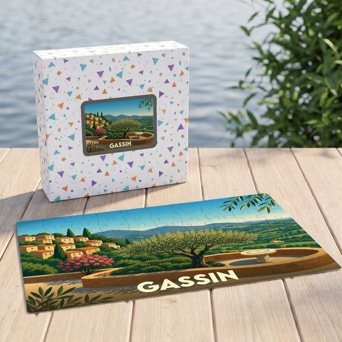 Puzzle souvenir de la ville de Gassin avec une illustration stylisée d'un paysage provençal.