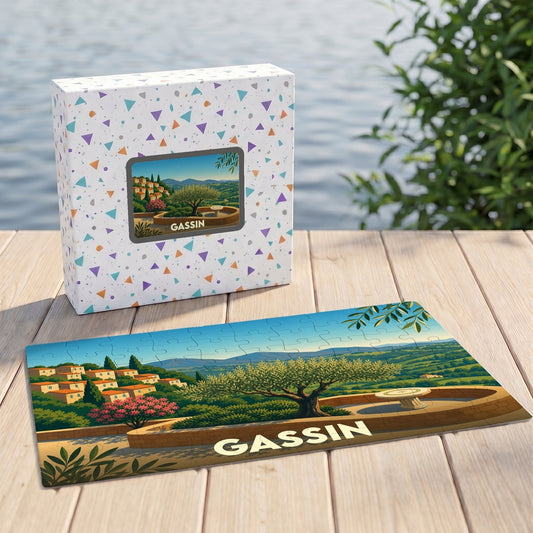 Puzzle souvenir de la ville de Gassin avec une illustration stylisée d'un paysage provençal.