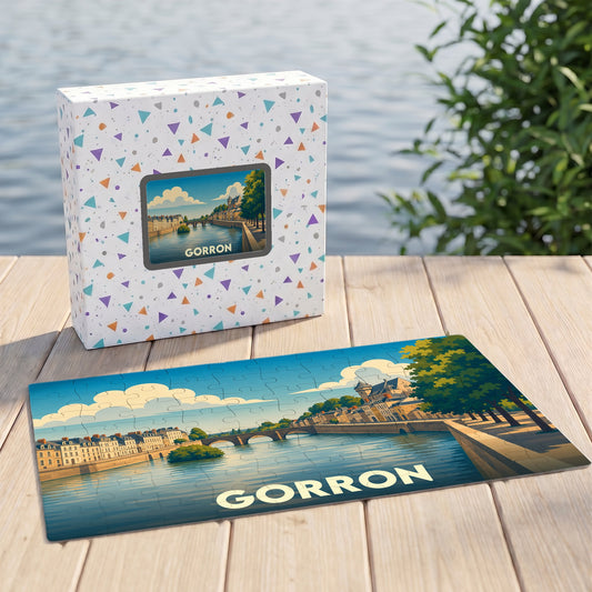Puzzle souvenir de la ville de Gorron avec une illustration stylisée des bords de l'eau et son emballage assorti.