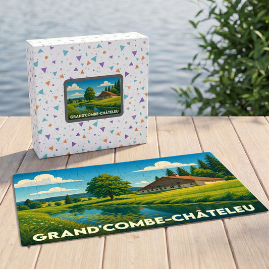 Puzzle souvenir de la commune de Grand'Combe-Châteleu avec une illustration de paysage rural et sa boîte assortie.