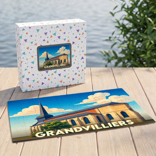 Puzzle souvenir de la ville de Grandvilliers avec une illustration stylisée d'une église sur sa boîte et ses pièces assemblées.