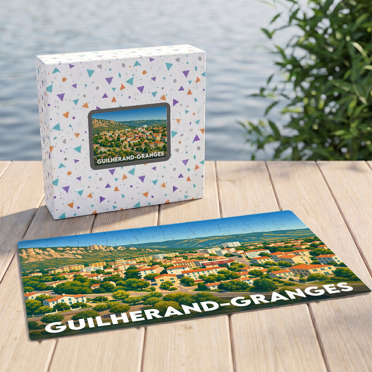 Puzzle souvenir de la ville de Guilherand-Granges avec une illustration panoramique stylisée.