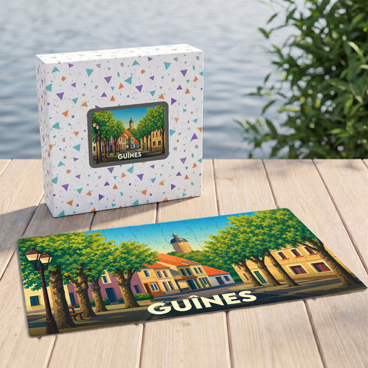 Puzzle souvenir de la ville de Guînes avec une illustration stylisée d'une rue arborée.