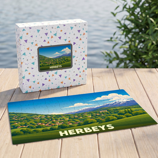 Puzzle souvenir de la ville d'Herbeys avec une illustration panoramique stylisée de ses paysages et montagnes.
