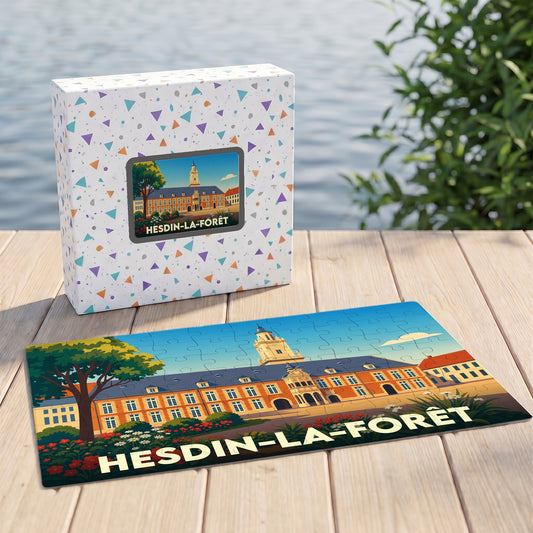 Puzzle souvenir de la ville de Hesdin-la-Forêt illustré d'un bâtiment historique stylisé, présenté avec sa boîte assortie.