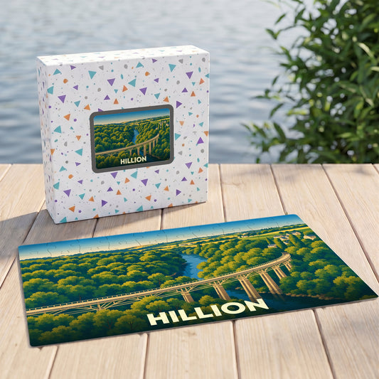 Puzzle souvenir de la ville de Hillion avec une illustration stylisée d'un viaduc surplombant une forêt et une rivière.