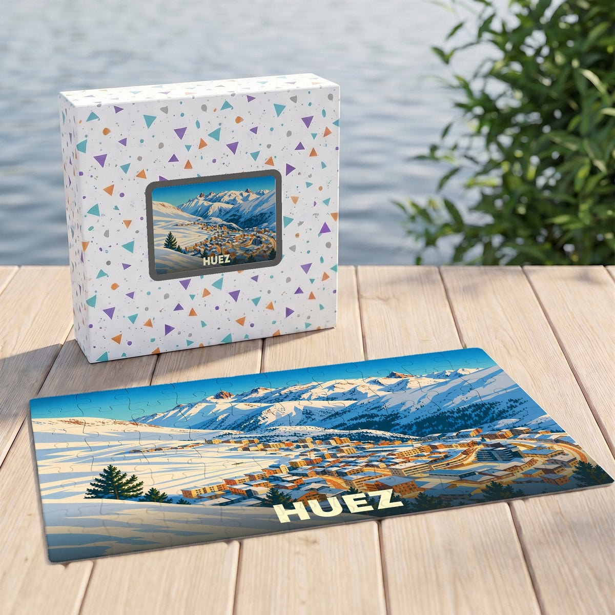 Puzzle souvenir de la ville de Huez illustré d'un paysage montagneux enneigé.
