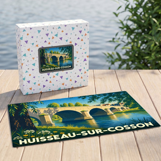 Puzzle souvenir de la ville de Huisseau-sur-Cosson illustrant un pont de pierre sur une rivière.