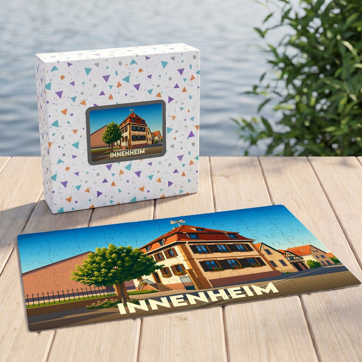 Puzzle souvenir de la ville d'Innenheim avec une illustration stylisée d'un bâtiment alsacien typique.