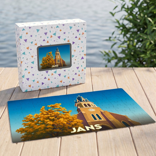 Puzzle souvenir de la ville de Jans représentant une église et un arbre automnal dans un style illustré.