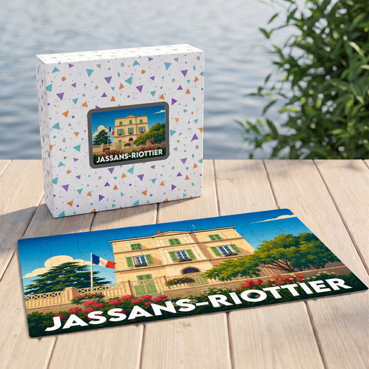 Puzzle souvenir de la ville de Jassans-Riottier avec une illustration colorée représentant une demeure historique sous un drapeau français.