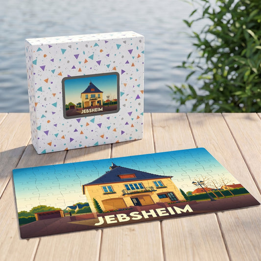 Puzzle souvenir de la ville de Jebsheim avec une illustration stylisée d'une maison alsacienne.