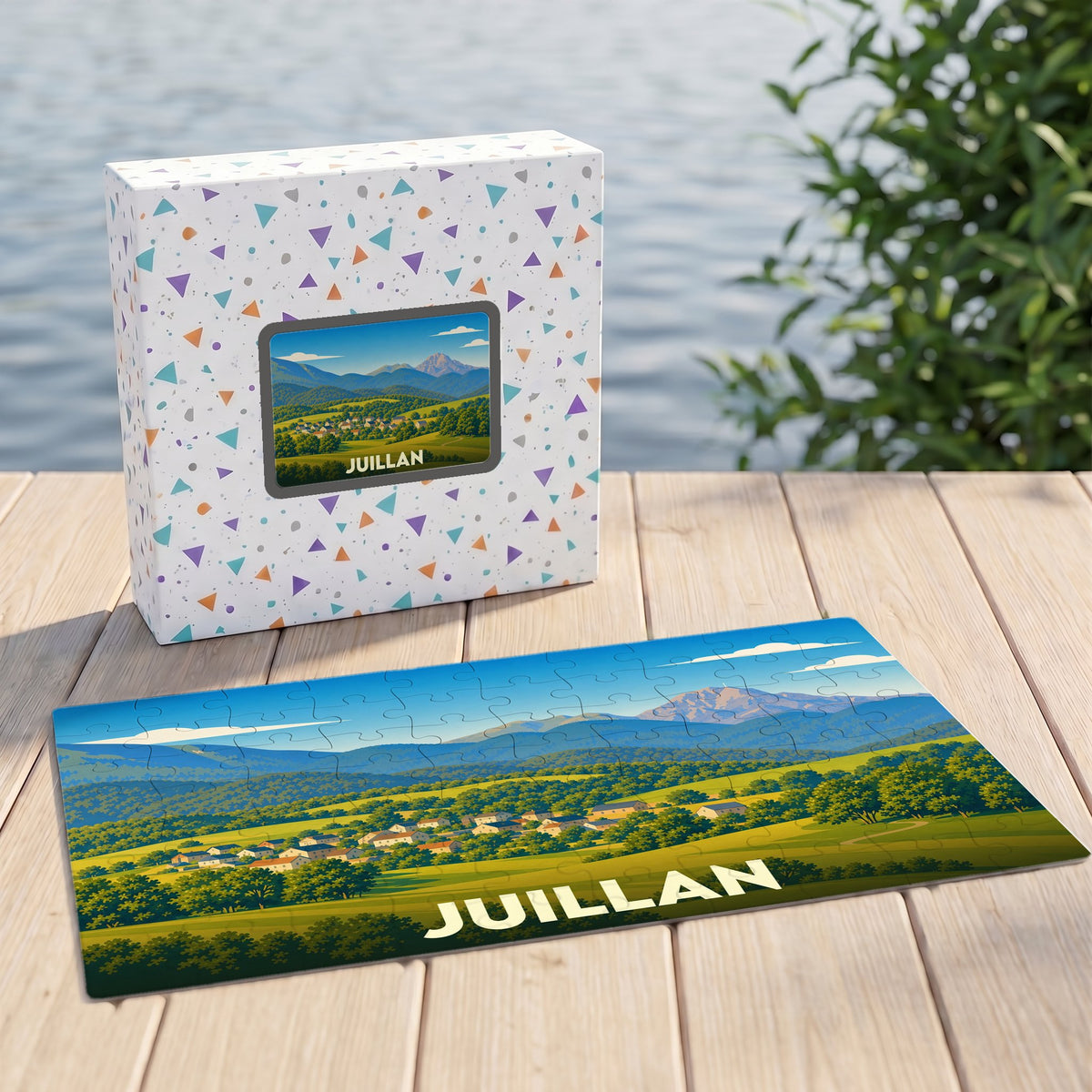 Puzzle souvenir de la ville de Juillan avec une illustration de paysage montagneux.
