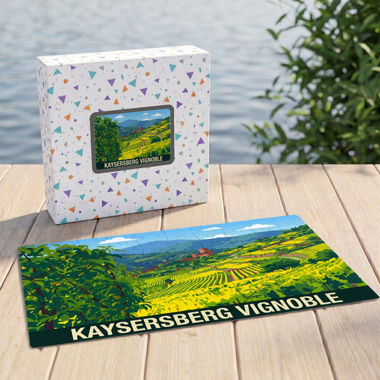 Puzzle souvenir de Kaysersberg Vignoble avec une illustration stylisée d'un paysage de vignes.