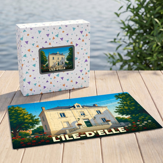 Puzzle souvenir de la ville de L'Île-d'Elle représentant une demeure traditionnelle sous un ciel bleu.