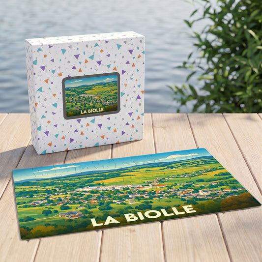 Puzzle souvenir de la ville de La Biolle avec une illustration stylisée d'un paysage verdoyant.
