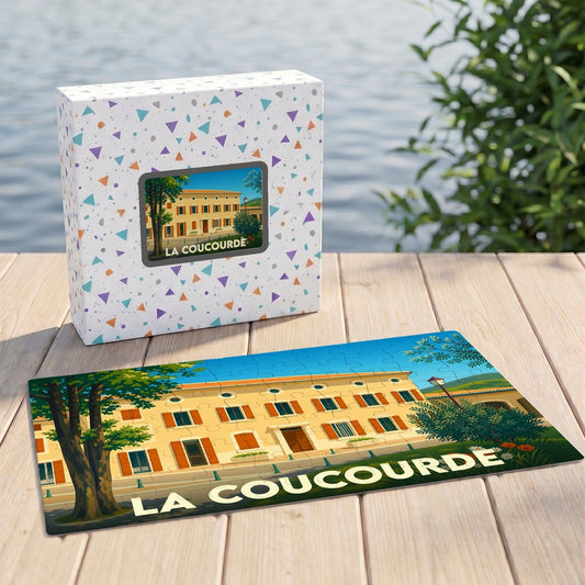 Puzzle souvenir de la ville de La Coucourde illustré par un bâtiment provençal stylisé.