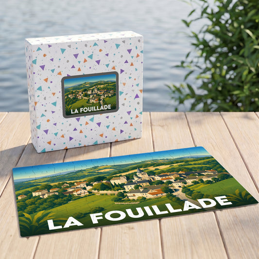 Puzzle souvenir de la commune de La Fouillade illustrant un paysage de village vallonné.