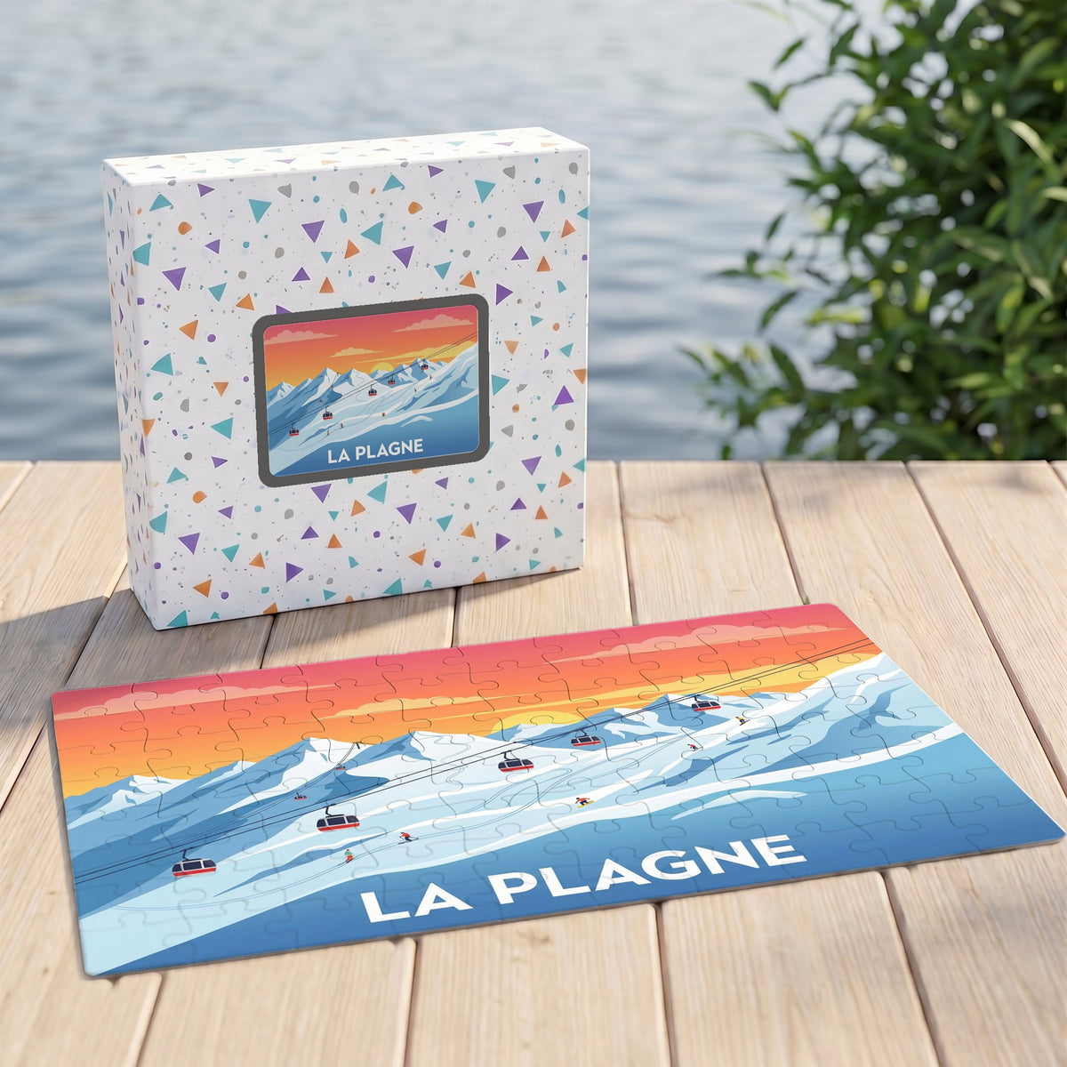 Puzzle souvenir de la station de La Plagne présentant une illustration stylisée de montagnes enneigées et de téléphériques au coucher du soleil.
