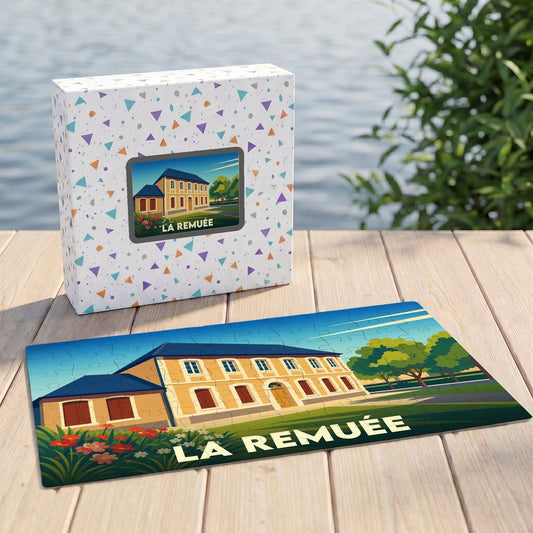 Puzzle souvenir de la commune de La Remuée avec une illustration stylisée d'un bâtiment historique.