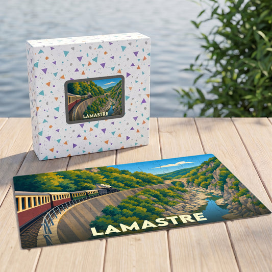 Puzzle souvenir de la ville de Lamastre représentant un train à vapeur circulant dans un paysage de gorges verdoyantes.