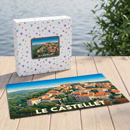 Puzzle souvenir de la ville de Le Castellet avec une illustration stylisée d'un village provençal.