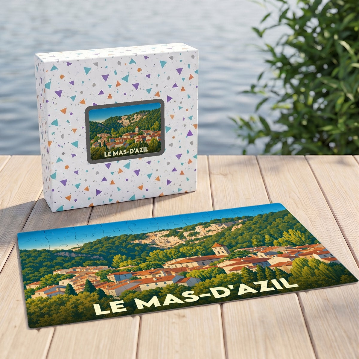 Puzzle souvenir de la ville de Le Mas-d'Azil avec son illustration paysagère et sa boîte assortie.