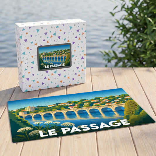 Puzzle souvenir de la ville de Le Passage avec une illustration stylisée d'un pont et son coffret assorti.