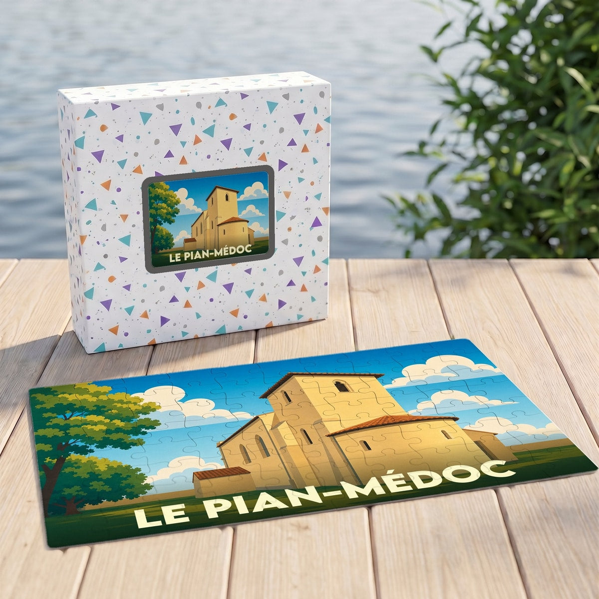 Puzzle souvenir de la ville de Le Pian-Médoc avec une illustration stylisée d'une église sous un ciel azur.