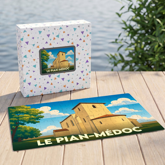 Puzzle souvenir de la ville de Le Pian-Médoc avec une illustration stylisée d'une église sous un ciel azur.