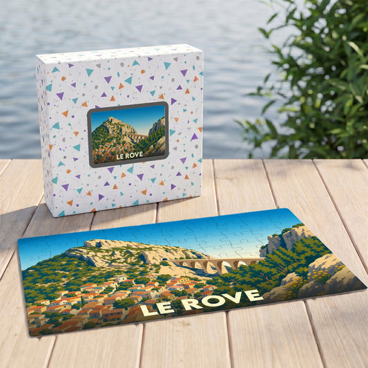 Puzzle souvenir de la ville de Le Rove avec une illustration stylisée d'un viaduc et d'un village provençal.