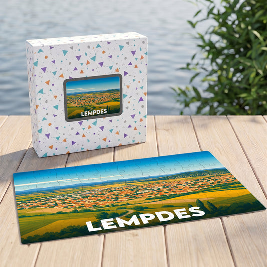 Puzzle souvenir de la ville de Lempdes avec une illustration stylisée d'un paysage panoramique.