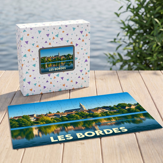 Puzzle souvenir de la ville de Les Bordes représentant un paysage avec son église se reflétant dans l'eau.