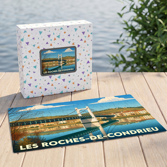 Puzzle souvenir de la ville de Les Roches-de-Condrieu avec une illustration stylisée d'un pont suspendu.