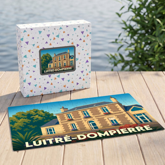 Puzzle souvenir de la ville de Luitré-Dompierre avec une illustration stylisée d'une grande demeure.