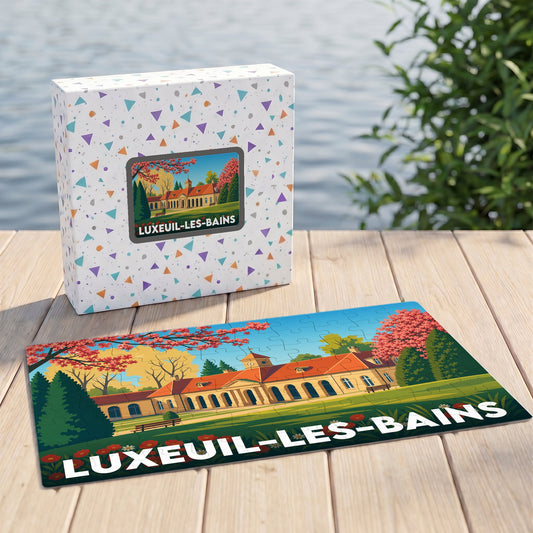 Puzzle souvenir de la ville de Luxeuil-les-Bains avec une illustration stylisée d'un bâtiment thermal.