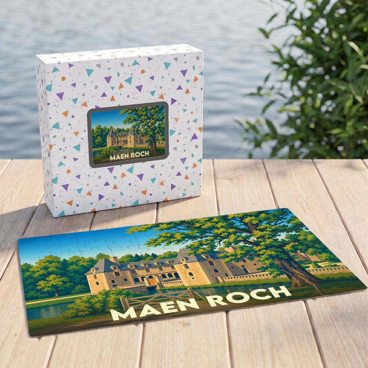 Puzzle souvenir de la ville de Maen Roch avec une illustration stylisée d'un château en bord de l'eau.